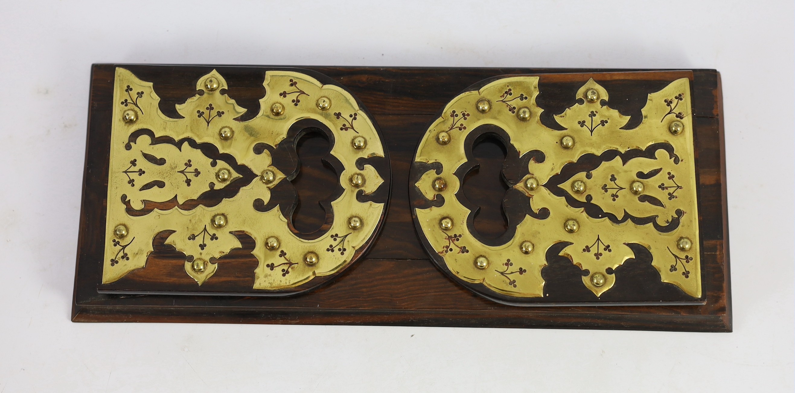 A Victorian brass mounted coromandel wood stationery casket with matching blotter, a similar book rack and gallery tray, 26cm